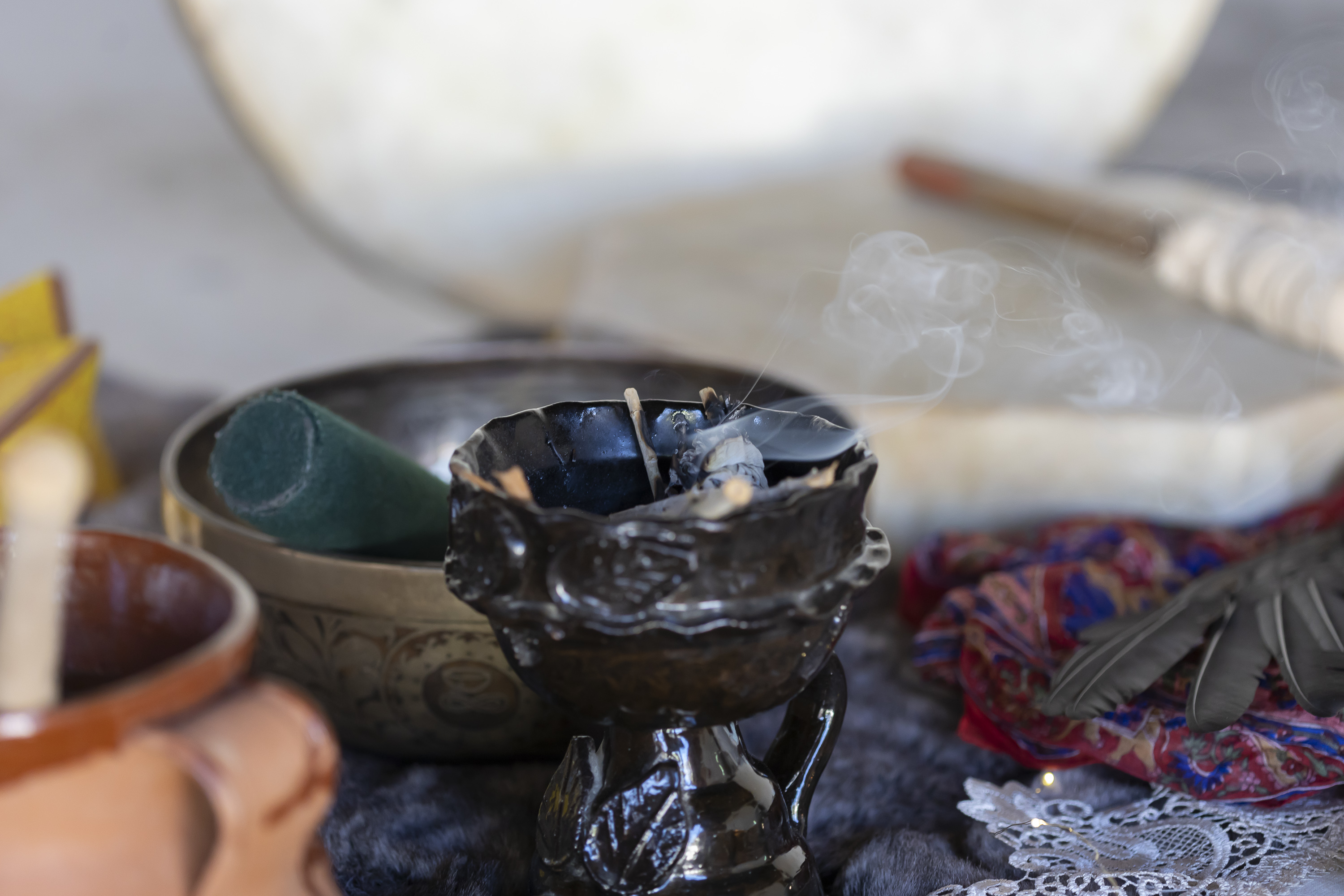 Ceremonial setup with cacao, shells, crystals, and candles prepared inside the Camp Cabo studio.